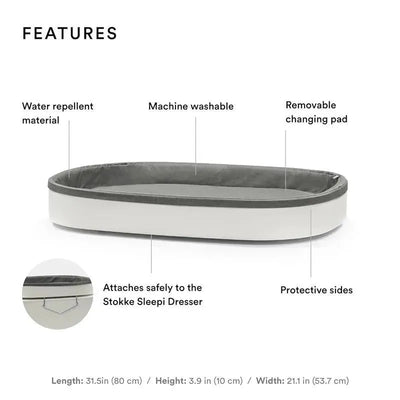 Stokke Sleepi Changer in white, featuring a removable changing pad, water-repellent material, and protective sides.