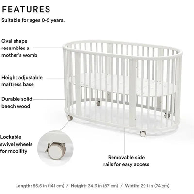 Oval-shaped Stokke Sleepi V3 Bed in white. Features height-adjustable base, solid beech wood, and lockable swivel wheels. Suitable for ages 0-5.