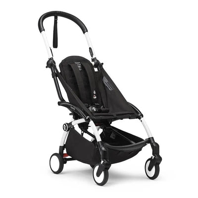 Stokke Yoyo³ stroller frame in black with a white frame, featuring a compact design and a mesh seat.