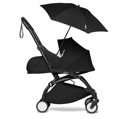 Stokke Yoyo Parasol in black, attached to a stroller, providing shade with a sleek design.