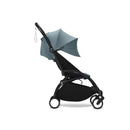 Stokke Yoyo³ stroller in black frame with aqua fabric, featuring a compact design and adjustable canopy.