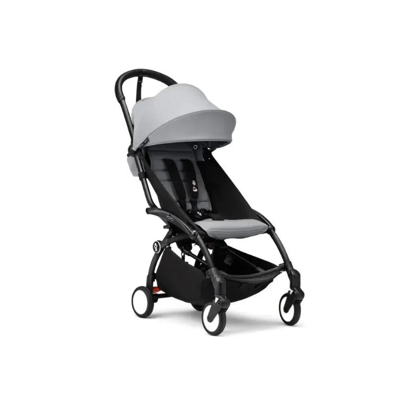 Stokke Yoyo³ stroller with a black frame and stone bundle leg rest, featuring a lightweight design and adjustable canopy.