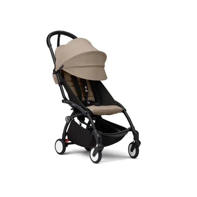 Stokke Yoyo³ stroller 6+, featuring a black frame and taupe fabric, with a foldable design and leg rest.