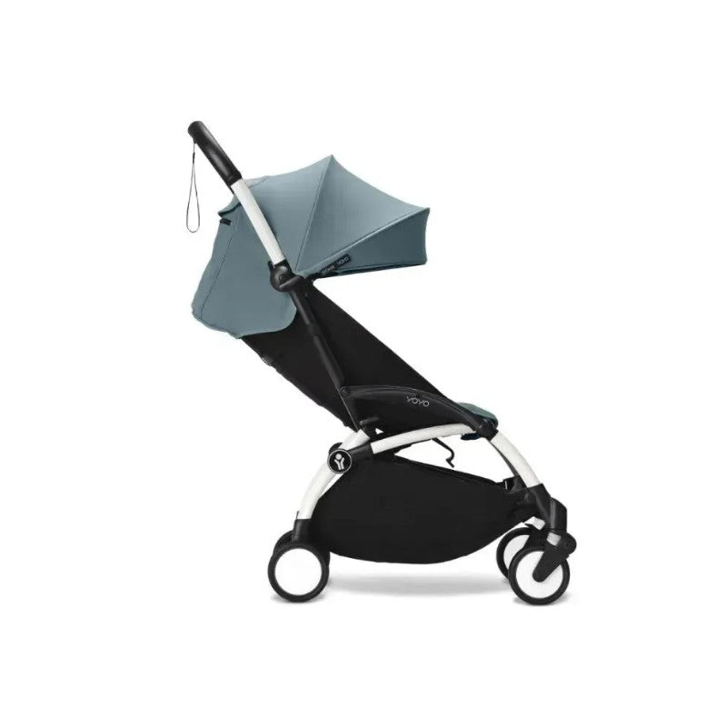 Stokke Yoyo³ stroller in white frame with aqua fabric, featuring a sun canopy and compact design suitable for children 6+.