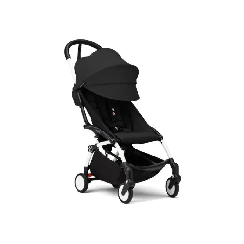 Stokke Yoyo³ stroller in black with a white frame, featuring a foldable design and ample leg rest.