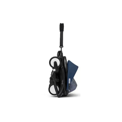 Stokke Yoyo³ stroller in black with Air France blue canopy, folded and ready for transport.