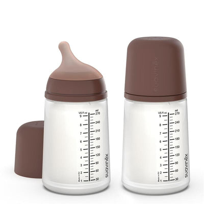 Suavinex 2-pack of 9 oz anti-colic baby bottles with medium flow nipples and deep brown caps.