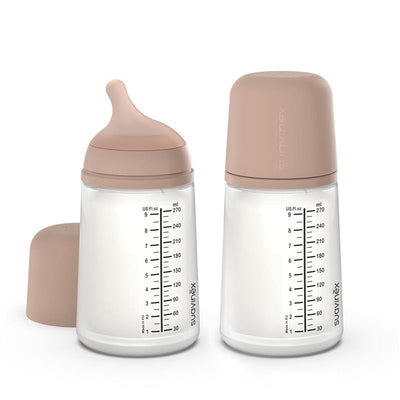 Suavinex 2-pack anti-colic baby bottles, 9 oz, with medium flow nipples and a soft medium tone design.