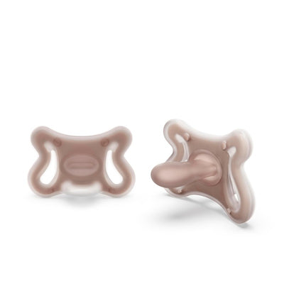 Two Suavinex silicone baby pacifiers with SX Pro physiological nipples in a soft beige color, designed for comfort.