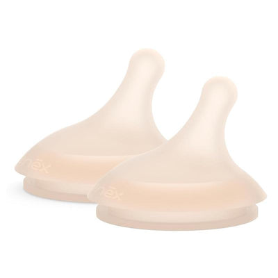 Two Suavinex Zero.Zero™ slow flow asymmetrical nipples in a light shade, designed for infants 0 months and older.