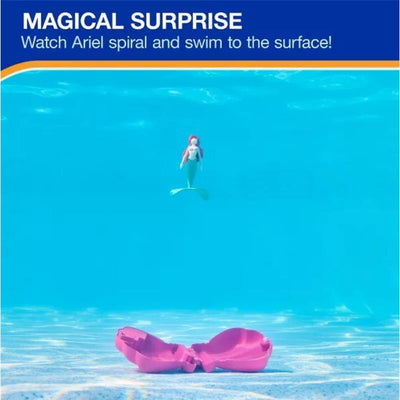 Swimways Ariel Dive N Surprise toy in clear water, featuring a mermaid figurine swimming to the surface with a pink shell below.