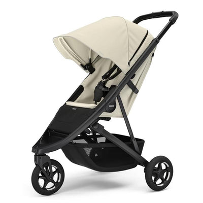 Single child stroller in soft beige with a black frame, featuring a sun canopy and safety harness.