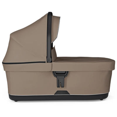 Thule Urban Glide 3 Bassinet in Tinted Taupe, featuring a sleek design with a protective canopy and secure attachment.