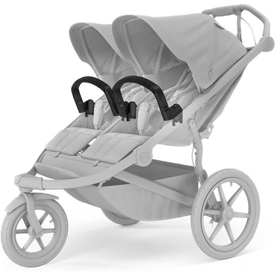 Thule Urban Glide 3 double stroller with a black bumper bar and adjustable canopies, showcasing a sleek design.