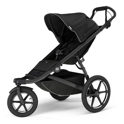 Thule Urban Glide 3 single child all-terrain stroller in black with a large canopy and a spacious lower storage basket.