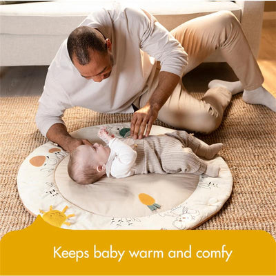 Father interacting with a baby on the Tiny Love Gymini mat from the Garden of Adventure collection, promoting comfort and warmth.