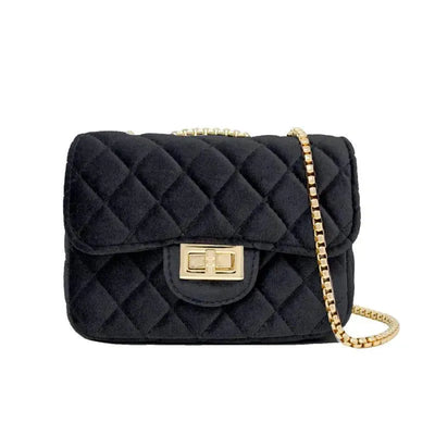 Classic large black suede handbag with a quilted design and gold chain strap.
