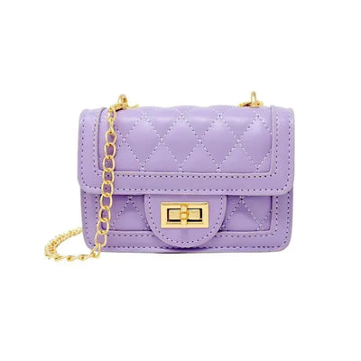 Lavender quilted mini purse with a gold chain strap and a decorative clasp closure.