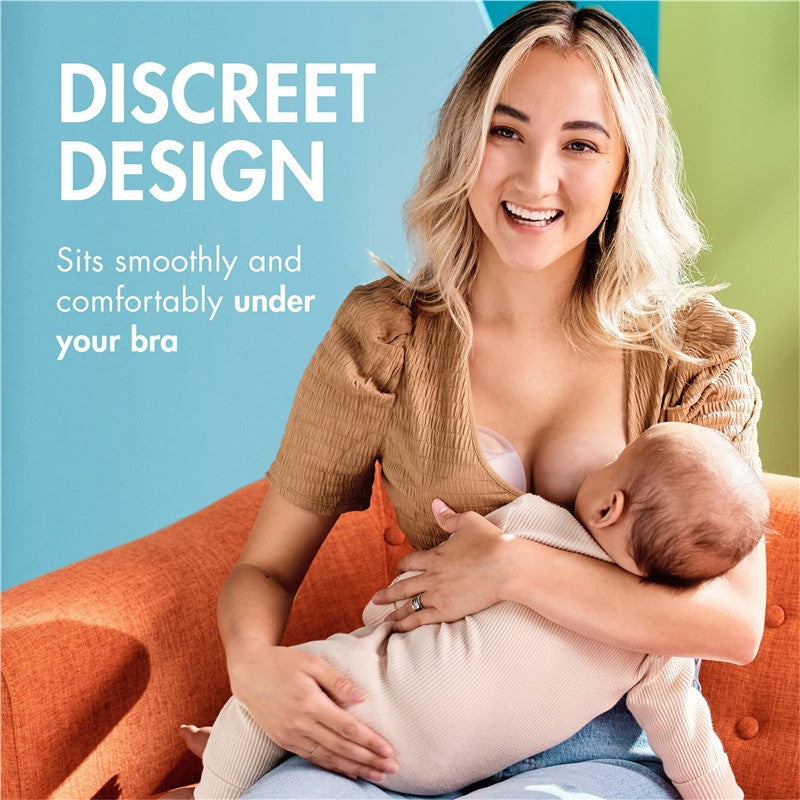 Boon TROVE silicone breast milk collection cups shown being used by a smiling mother holding her baby, with text highlighting discreet design.
