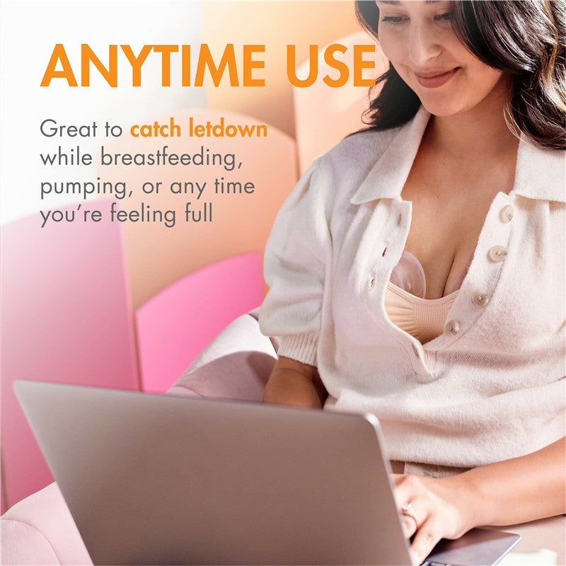 Silicone breast milk collection cup in use, showing a woman in a white cardigan working on a laptop, with text highlighting its anytime use.