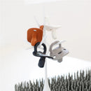 Boon LAWN drying rack with white TWIG accessories displaying colorful pacifiers hanging for drying.