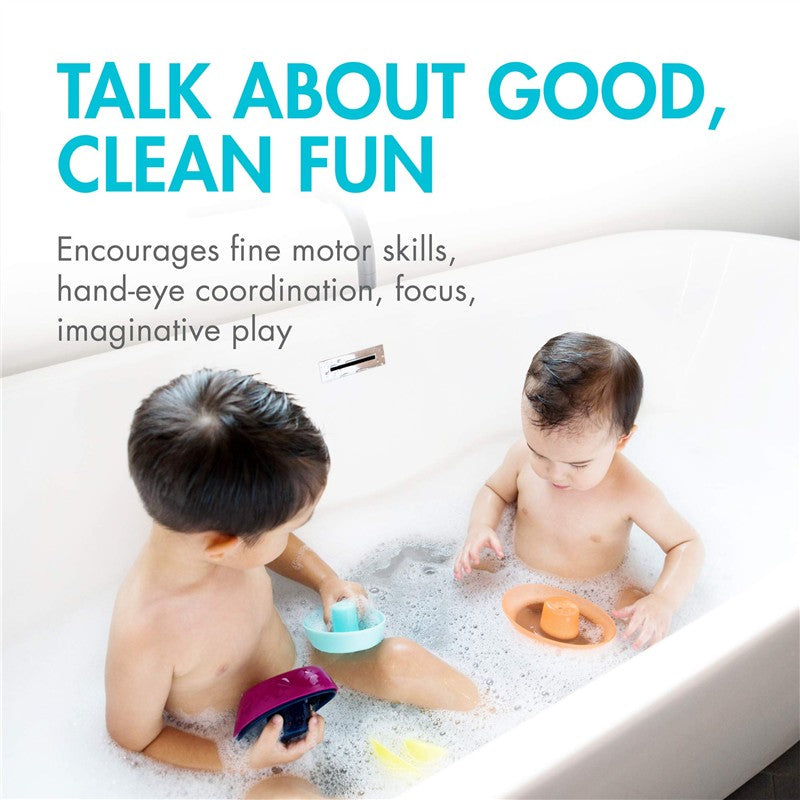 Children playing with Boon FLEET Stacking Boats in a bubbly bathtub, engaging in imaginative play and fine motor skills.