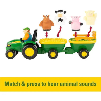 Toy tractor with two trailers, featuring animal figures; includes a prompt to match and press for animal sounds.