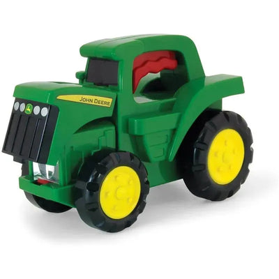 Green toy tractor flashlight with yellow wheels featuring the John Deere logo and a red handle.