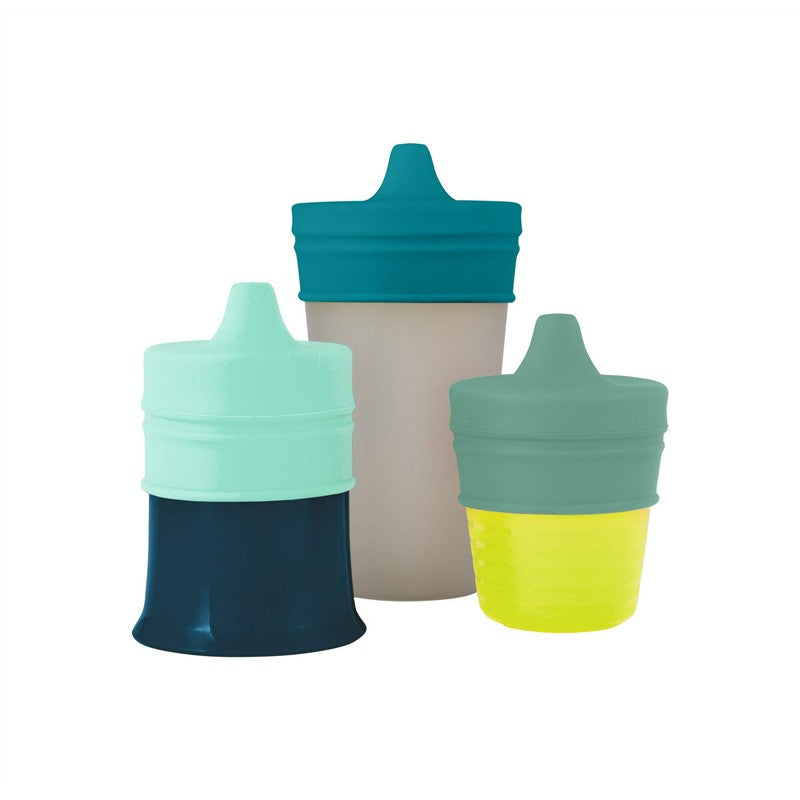 Universal silicone sippy lids in green, three-pack, fits various cups; features soft, colorful spouts for easy drinking.