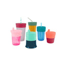 Boon SNUG Spout Universal Silicone Sippy Lids in pink, shown on various cups in multiple colors and sizes.