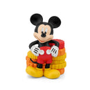 Mickey Mouse Clubhouse audio toy figurine, featuring Mickey in red shorts, black shirt, and cheerful pose, with colorful stacks behind.