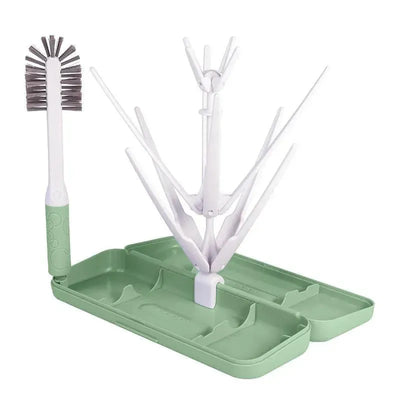 Ubbi On-The-Go Drying Rack & Brush Set in sage green, featuring a multi-pronged drying rack and a brush.