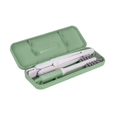Ubbi On-The-Go Drying Rack & Brush Set in sage, featuring a compact case with brush and drying tools.