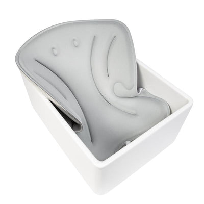 Soft gray Ubbi Stingray Sink Bather for baby, designed as a comfortable bath cushion for safer bathing.