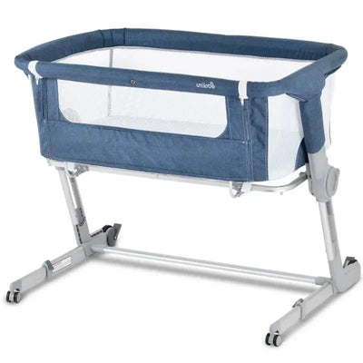 3-in-1 bedside sleeper in denim blue, featuring a mesh side for airflow and a stable, adjustable frame.
