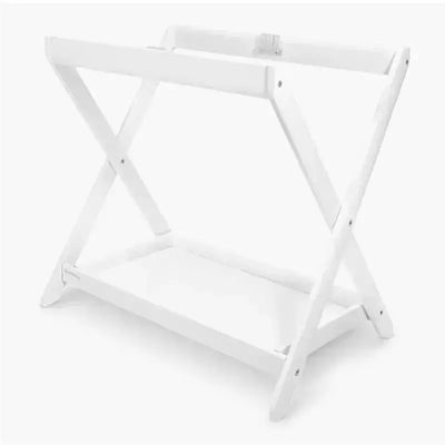 Uppababy Bassinet Stand in white, featuring a sturdy x-frame design and a flat base for secure support.