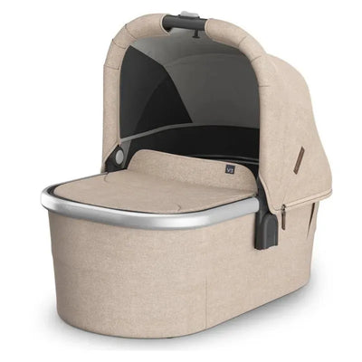 Uppababy Bassinet V3 in Declan (Oat Mélange) with a silver frame, featuring a sleek design and protective canopy.