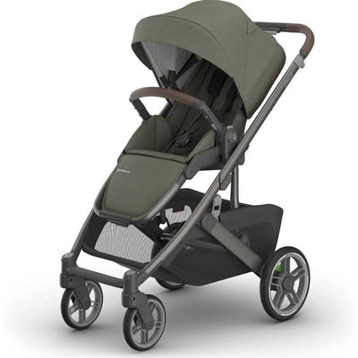 Uppababy Cruz V3 Stroller in Meadow Green with Graphite Frame and Chestnut Leather handles, featuring a spacious seat and storage basket.