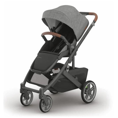 Uppababy Cruz V3 stroller in Charcoal Mélange with carbon frame and saddle leather handle, featuring a modern design.