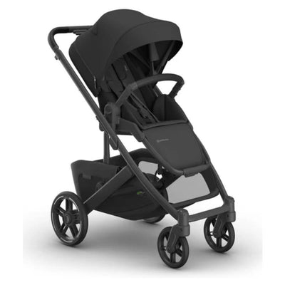 Uppababy Cruz V3 stroller in charcoal with a carbon frame and black leather details, featuring a spacious seat and canopy.