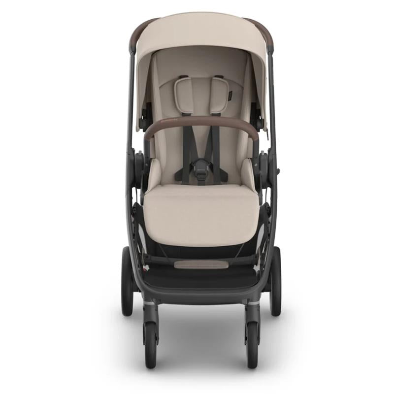 Uppababy Kona Stroller in Sandstone Mélange, featuring a cushioned seat, harness, and adjustable canopy, designed for child comfort.