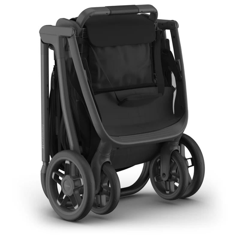 Uppababy Kona stroller in James Black, featuring a sleek design with a spacious seat and sturdy wheels, ready for travel.