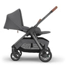 Uppababy Kona Stroller in Rowan (Graphite) with adjustable canopy, padded seat, and under-seat storage basket.