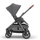 Uppababy Kona Stroller in Rowan (Graphite) with a large canopy and a storage basket, showcasing its sleek design and functionality.