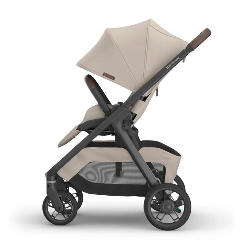 Uppababy Kona Stroller in Ada (Sandstone Mélange) with a large canopy, plush seat, and storage basket underneath.
