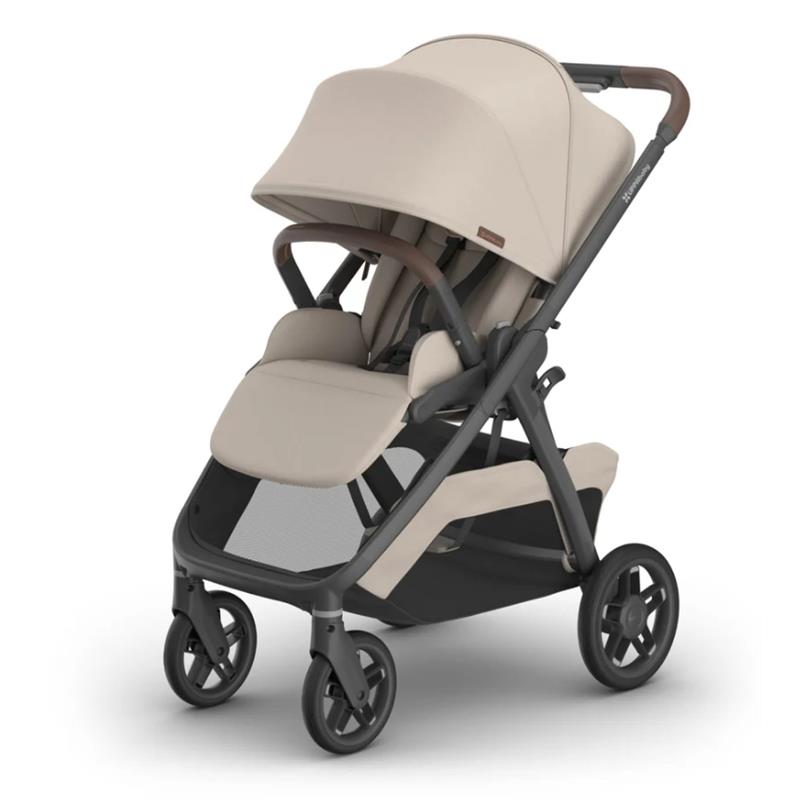 Uppababy Kona Stroller in sandstone mélange, featuring a large canopy, plush seat, and spacious undercarriage.