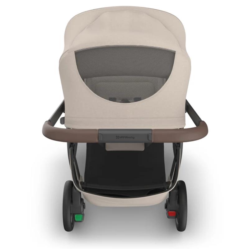 Uppababy Kona Stroller & Bassinet V3 Bundle in Sandstone Mélange with a beige fabric canopy, mesh window, and brown handle.