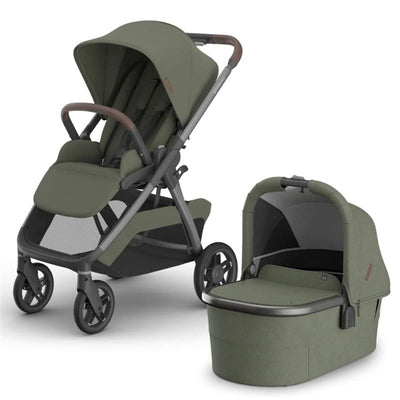 Uppababy Kona Stroller in Meadow Green with brown leather handle and detachable matching bassinet.