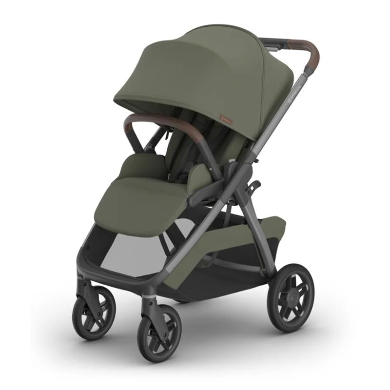 Uppababy Kona Stroller in Meadow Green with a spacious seat, adjustable canopy, and brown handlebar.