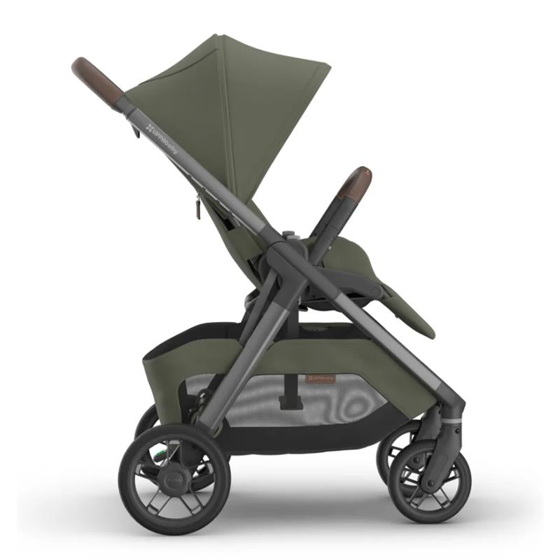 Uppababy Kona Stroller in Meadow Green with a reclining seat, adjustable canopy, and sleek frame design.